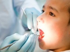 Boy visiting the dentist taking good care of his teeth