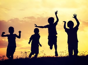 Children playing on summer sunset meadow-1