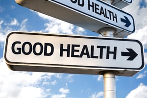 Good Health direction sign on sky background