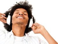 Afro man enjoying listening to music  - isolated over a white background