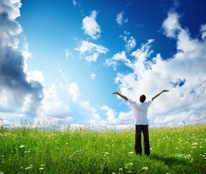 field of grass and happy young man